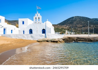 Beautiful white church on shore of sandy beach in Platis Gialos village, Sifnos island, Greece - Powered by Shutterstock