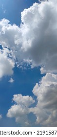 Beautiful White Clouds On Deep Blue Sky Background. Elegant Blue Sky Picture In Daylight. Large Bright Soft Fluffy Clouds Are Cover The Entire Blue Sky. Cumulus Clouds Against Blue Sky. No Focus