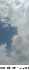 Beautiful White Clouds On Deep Blue Sky Background. Elegant Blue Sky Picture In Daylight. Large Bright Soft Fluffy Clouds Are Cover The Entire Blue Sky. Cumulus Clouds Against Blue Sky. No Focus