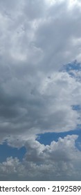 Beautiful White Clouds On Deep Blue Sky Background. Elegant Blue Sky Picture In Daylight. Large Bright Soft Fluffy Clouds Are Cover The Entire Blue Sky. Cumulus Clouds Against Blue Sky. No Focus