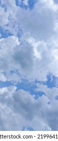 Beautiful White Clouds On Deep Blue Sky Background. Elegant Blue Sky Picture In Daylight. Large Bright Soft Fluffy Clouds Are Cover The Entire Blue Sky. Cumulus Clouds Against Blue Sky. No Focus