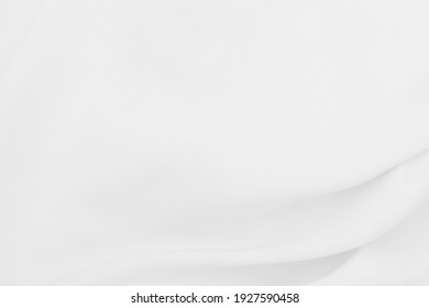 Beautiful white fabric waves, soft focus, used for backgrounds. White cloth background - Shutterstock ID 1927590458
