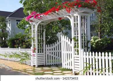beautiful white gate in the flovers