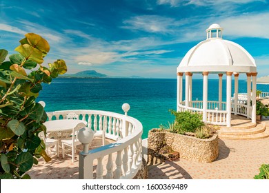 Beautiful White Gazebo And Tropical Garden On Caribbean Ocean Background, Summer Mountain View , Sosua, Puerto Plata, Dominican Republic