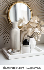 Beautiful white home interior decoration with vases and mirror