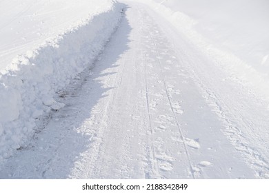 beautiful white landscape, Swiss Alps, wide alpine winter road cleared, large snowdrifts on the side, snowfall in in the city, Sport Concept, Healthy Lifestyle, Winter Activity, travel by car