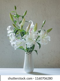 Beautiful White Lily In Vase On Background Old Wall