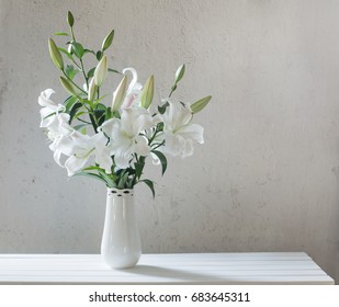 Beautiful White Lily In Vase On Background Old Wall