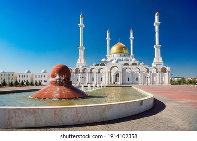A beautiful white mosque in the city. Kazakhstan, Central Asia. Islam, religion and architecture.