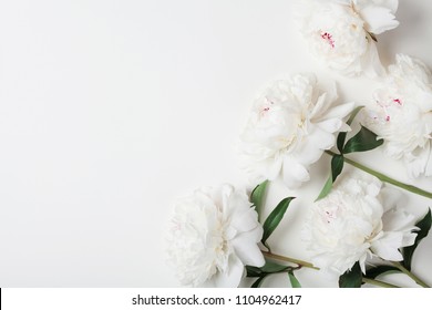 Beautiful White Peony Flowers Bouquet On Pastel Table Top. Flat Lay Style. 