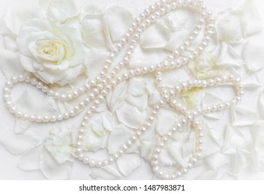 Beautiful white rose with petals and pearl necklace on white background. Ideal for greeting cards for wedding, birthday, Valentine's Day, Mother's Day - Powered by Shutterstock
