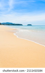 Beautiful White Sand Popular Beach Sunrise,sunset,Waves Texture Lapping Across Untouched Shore.Top View Clear Beach Sea Island.Blue Sea Waves And Sky Clean Beach. Drone Aerial View Landscape. 