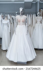 Beautiful White Wedding Dress On Mannequin In Trendy Bridal Show Room 