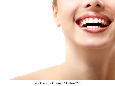 Beautiful wide smile of young fresh woman with great healthy white teeth. Isolated over white background