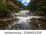 Beautiful Willow River Falls on a cool August summer day in Willow River State Park in Hudson, Wisconsin USA.