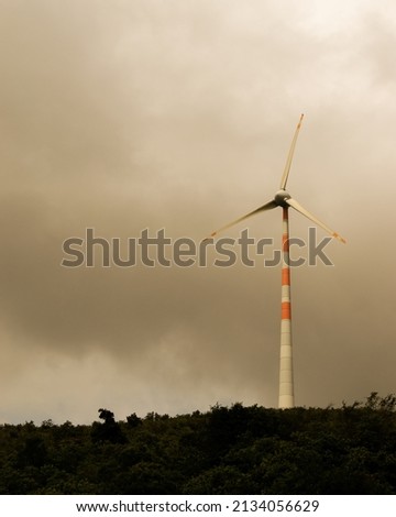 Beautiful Windmill with dark warm climate.