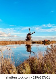 Beautiful Windmills In Rotterdam With Blue Shy