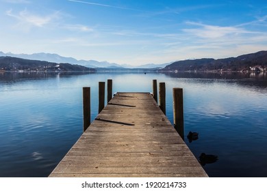 Beautiful winter day on a pier at lake Wörthersee