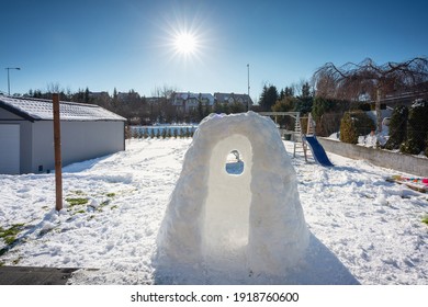 Beautiful Winter Garden With Snow Igloo At Sunny Day. Poland