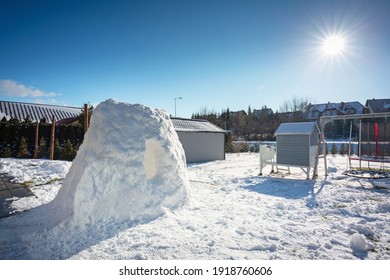 Beautiful Winter Garden With Snow Igloo At Sunny Day. Poland