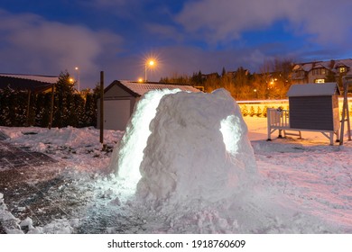 Beautiful Winter Garden With Snow Igloo At Night. Poland