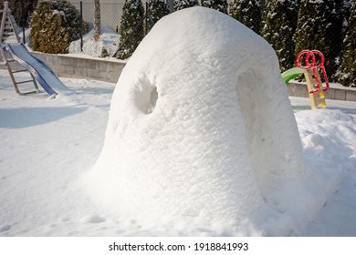 Beautiful Winter Garden With Snow Igloo At Sunny Day. Poland