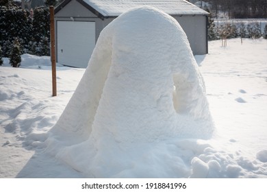 Beautiful Winter Garden With Snow Igloo At Sunny Day. Poland