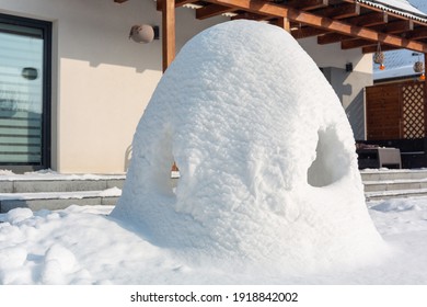 Beautiful Winter Garden With Snow Igloo At Sunny Day. Poland