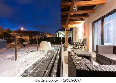 Beautiful winter garden terrace with snow at night. Poland