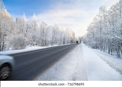 Beautiful Winter Landscape With Asphalt Road,forest And Blue Sky.  Frozen Wintry Day And Path Drive.