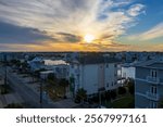 a beautiful winter landscape with condos and homes and yachts and boats docked in the water at sunset in Carolina Beach North Carolina USA