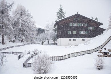 Beautiful Winter Landscape With A Mountain House In Snowstorm