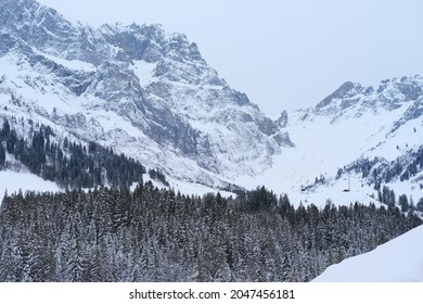 beautiful winter landscape, snow-covered trees, mountainpass, snowfall in the mountains, Swiss Alps in the snow, walks in the winter white forest, tourism, winter sports - Shutterstock ID 2047456181