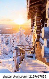 Beautiful Winter Landscape With Wooden Hut And Snow Covered Trees At Sunset In Lapland Finland