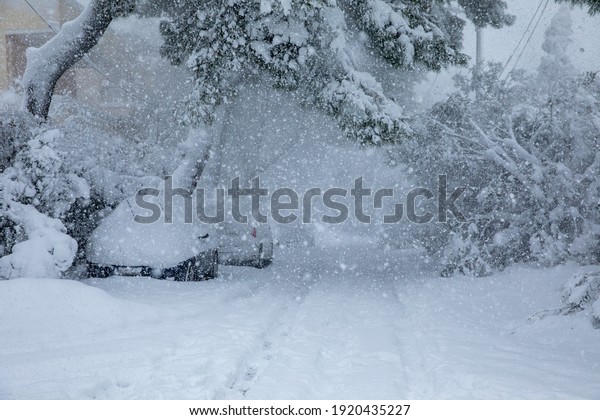 Beautiful winter morning snow\
covered streets of Athens, Greece, 16th of February 2021.\
Horizontal.