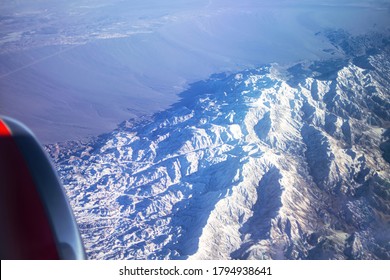 Beautiful Winter Mountains From The Plane Window. Mountain Tourism.