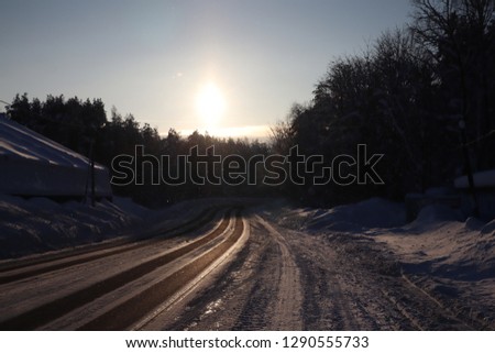 beautiful winter road in the sunny day