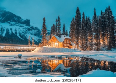 Beautiful winter scene of wooden lodge glowing on Emerald Lake and pine forest at Yoho national park, British Columbia, Canada - Powered by Shutterstock