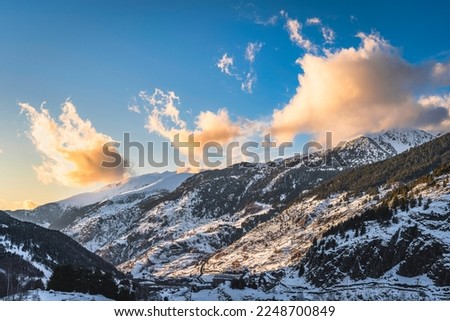 Beautiful winter scenery with El tarter village and mountains illuminated by sunset. Ski winter holidays in Andorra, Pyrenees Mountains