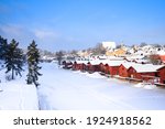 Beautiful winter scenery of wooden houses and frozen river at Porvoo old town, Finland. One of the most famous town for tourist