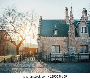 Beautiful Winter Sunrise On The Old European Streets. Bruges, Belgium 