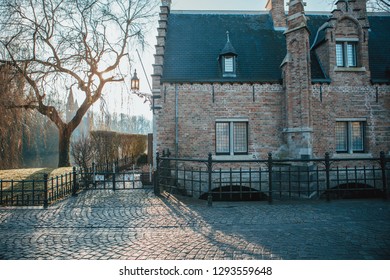 Beautiful Winter Sunrise On The Old European Streets. Bruges, Belgium 