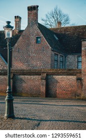 Beautiful Winter Sunrise On The Old European Streets. Bruges, Belgium 