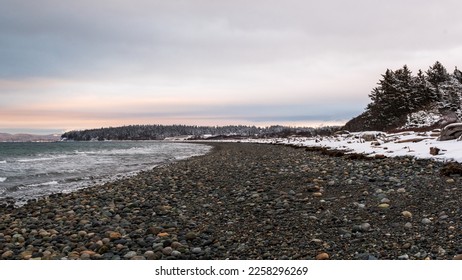 Beautiful winter sunset on snowy beach, Whidbey Island, Washington  - Shutterstock ID 2258296269
