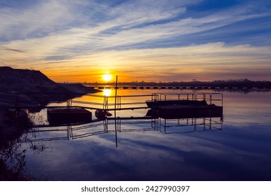 Beautiful winter sunset in the river. Riverscape sunset. Sunset at Tagus River, in the portuguese village of Chamusca - Powered by Shutterstock