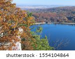 Beautiful Wisconsin ice age nature background. Scenic autumn landscape with blue lake from West Bluff rocky hiking trail at Devils Lake State Park, Baraboo area, Wisconsin, Midwest USA.