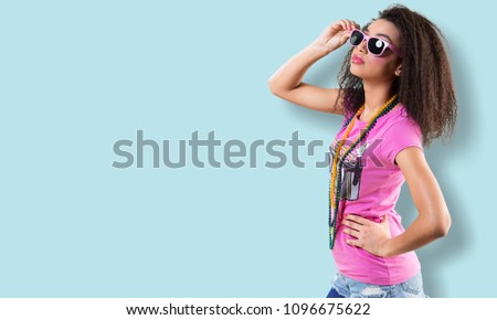 Similar – Woman with sunglasses looking at camera over garden fence