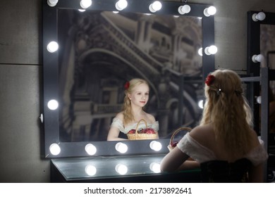 Beautiful Woman Actress Or Singer In Retro Dress In The Dressing Room Before A Mirror