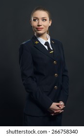 Beautiful Woman Airline Pilot With Arms Crossed