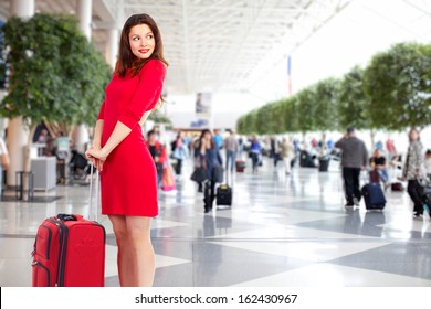 Beautiful woman in airport. Business travel background.